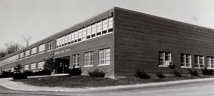 Black and white photograph of the front side of Marshall Road Elementary School, taken circa 1968. The trees and shrubs in front of the building are very small and look to have been planted on a few years prior. 